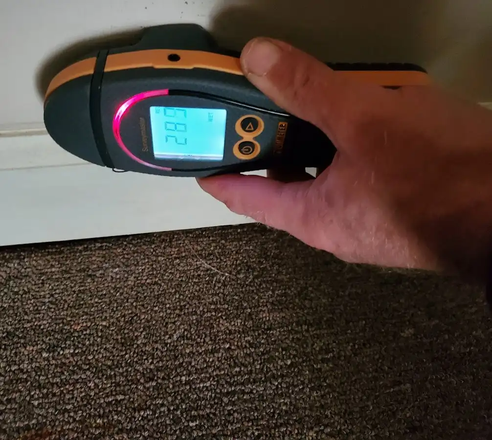 Moisture detection at baseboard during Storm Damage Restoration in Fort Campbell North